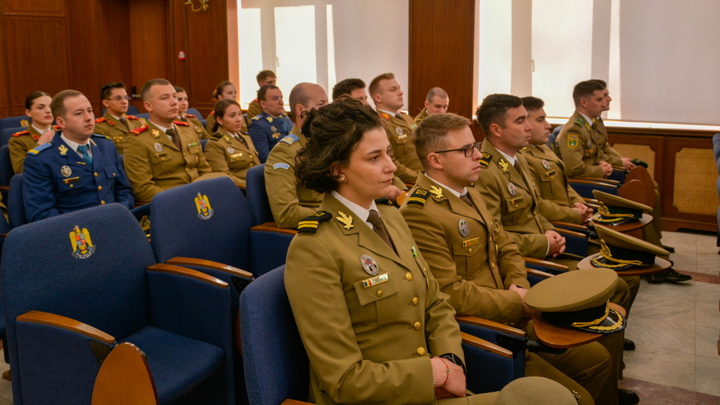 Students at the "Nicolae Balcescu" Land Forces Academy listen to a panel discussion